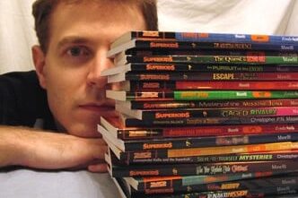 Christopher Maselli with his books